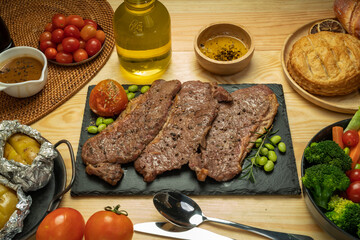 Kamui Wagyu Beef Strip Lloyd marble Steak Grill with fresh vegetaber salad, Baked Potatoes with butter