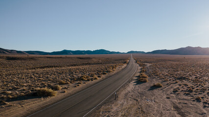 Road in Death Valley, California. Open highway beckoning the desert and mountains of Death Valley in California.