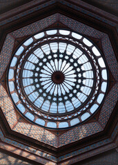 Moorish dome design with geometric patterns in steel and glass.