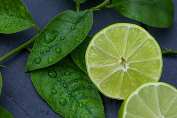 Fresh Cut Lime On Wet Dark Stone Close-up