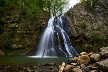 Naklejka na ściany i meble Beautiful natural romanian waterfall Bucias , in Carpathian mountains Roumania