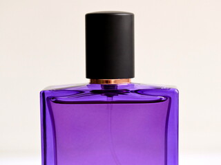 Purple glass perfume bottle isolated on white background.