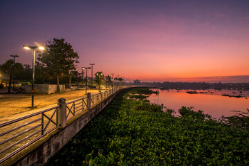 The background of the sea by the evening sea, with natural beauty (sea water, rocks, sky) and fishermen are fishing by the river bank, is a pleasure during travel.