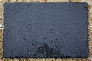 Wet Dark Stone on Textured Countertop
