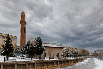 Fototapeta na wymiar Egri Minare Mosque view during snowing in Aksaray of Turkey