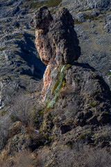 Rock formation and spring El Cogullón. Cave of Valporquero, Leon, Spain.