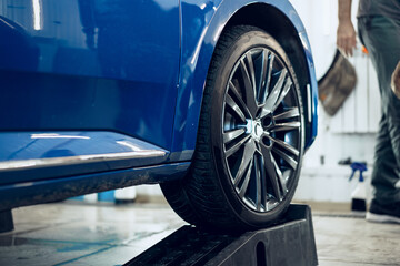 Front wheel of modern blue sport car
