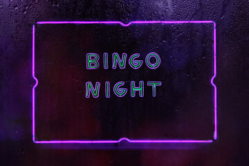 Neon Bingo Night Sign in Rainy Window