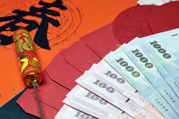 Spring Festival couplets, red envelopes and money on the table. Concept for Chinese New Year and lucky money. The words on couplets are used to pray for a better life and luck.