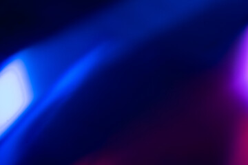 Blur color flare. Neon glow background. Bokeh radiance reflection. Defocused fluorescent blue...
