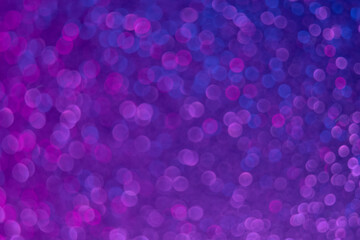 Bokeh glow. Fluorescent background. Blur firework sparks . Defocused neon purple blue color light...