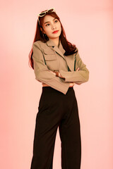 Portrait studio shot of Asian young urban trendy female hipster teenager fashion model in casual...