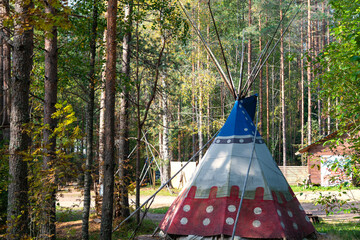 An Indian teepee tent or installed on a lawn in a recreation park in order to demonstrate the Indian way of life. An exact replica of the Indian dwelling  © Дмитрий Березнев