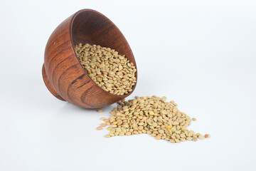 Pile of green lentil isolated on mock-up white background.