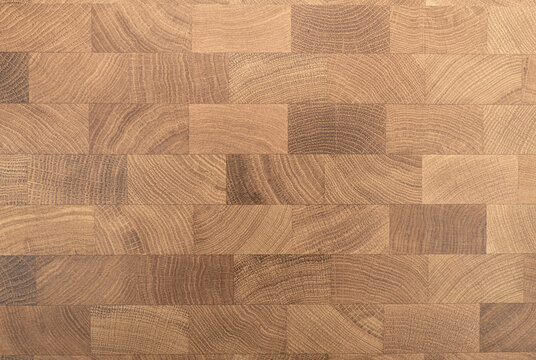 Wood texture background. Wooden mosaic pattern for decorating interior surfaces, floors, tables. Parquet, laminate and floor coverings.