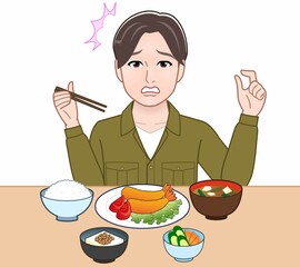 食事をしている若い男性