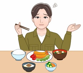 食事をしている若い男性