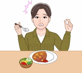 食事をしている若い男性
