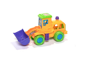 Colorful bulldozer toy isolated on white background.