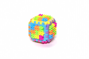 Plastic cube toy isolated on white background.