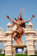 Fototapeta na wymiar Statue of Dancing Shiva as Nataraja at gate of Nilkanthdham, Swaminarayan temple complex, Poicha, Poicha, Gujarat, India