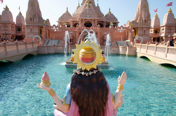 Goddess Narmada overseeing the Neelkanth Sarovar, artificial pond and Sandstone mandaps, Neelkanth Dham Swaminarayan Temple, Poicha, Gujarat, India, located at Poicha, Gujarat, India
