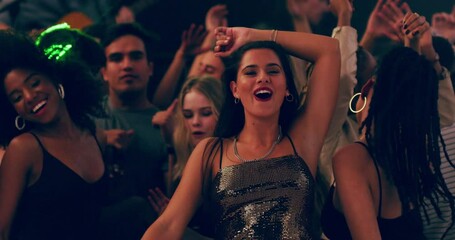 Dress like a lady, party like a rockstar. Group of beautiful young women celebrating and dancing at a party with friends. Diverse crowd having fun at a festival, concert, party, or rave - Powered by Adobe