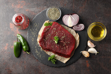 Concept of tasty food with raw beef steak, top view