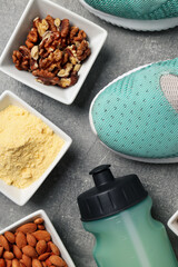 Concept of sports nutrition on gray textured background
