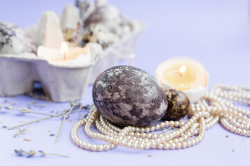 Easter eggs on a purple background. Close-up. Selective focus