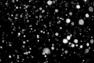 Falling snow background. Defocused. Winter Magic