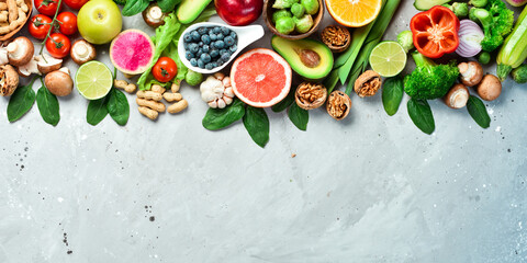 Healthy foods low in carbohydrates. Fresh broccoli, avocado, nuts, tomatoes and citrus fruits. The...
