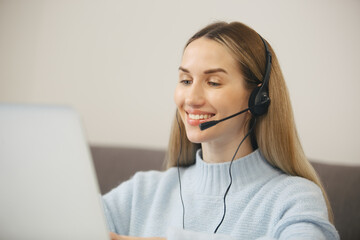 Friendly online support operator woman talking to client on web camera. Cheerful helpdesk...