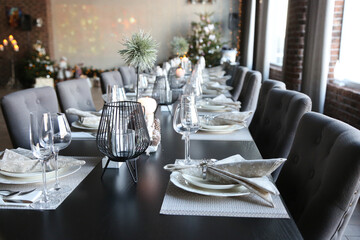 served table with plates, glasses and cutlery