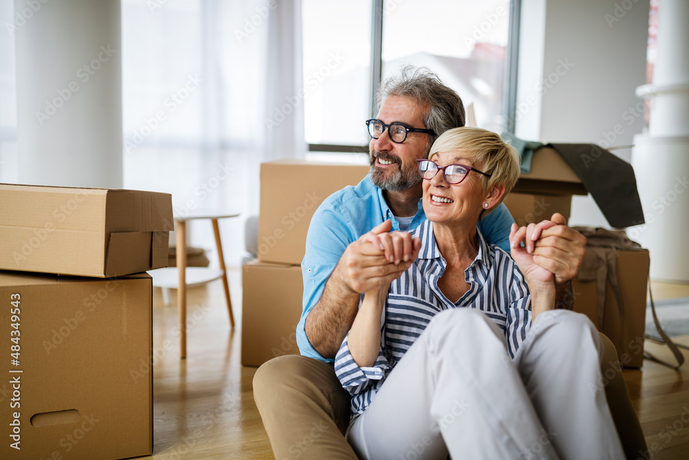 Wall mural portrait of happy senior couple in love moving in new home