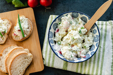 Cottage cheese with chives and radish. Light nutritious breakfast