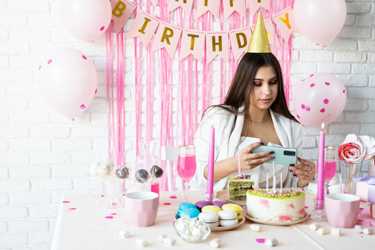 Beautiful woman celebrating birthday party taking selfie