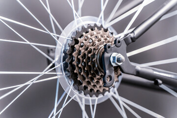 Asterisks and spokes of a bicycle. Steel structural element of the bicycle mechanism, fastening and...