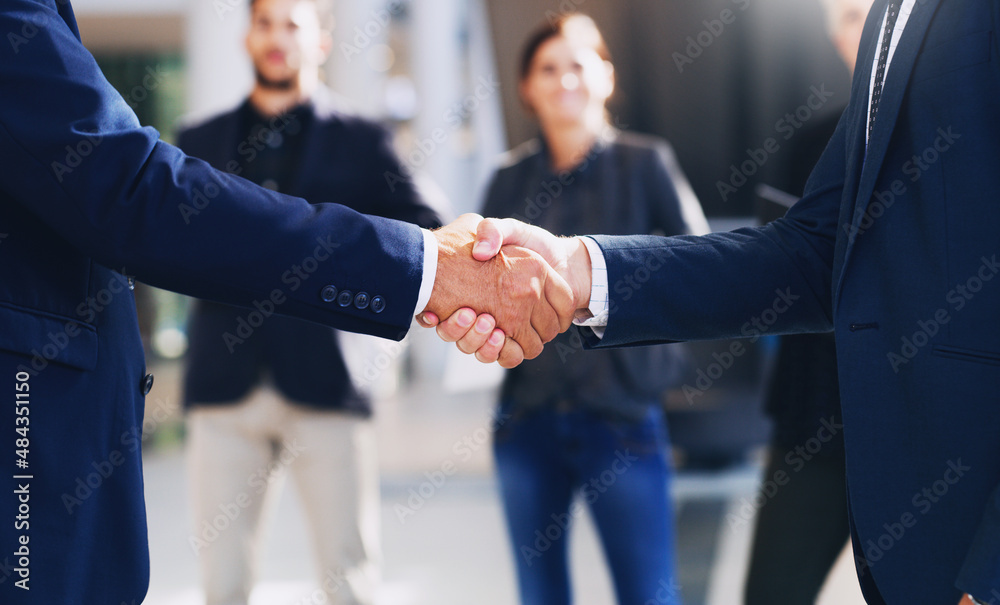Poster congratulations, lets do this. cropped shot of two unrecognizable businesspeople shaking hands while