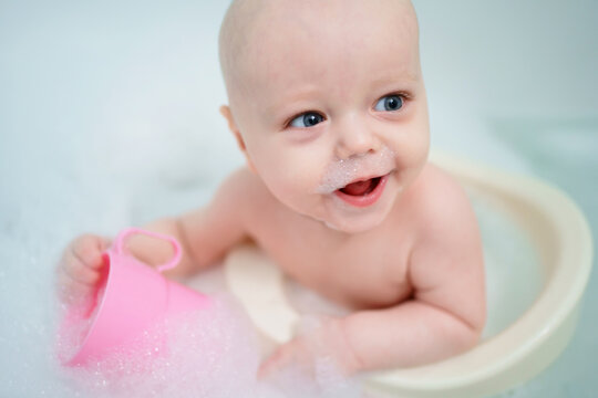 baby bathes in the bathroom. High quality photo