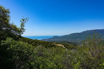 View of the Crimean Mountains plateau and the Black Sea from the top of the Demerdzhi. Russia.