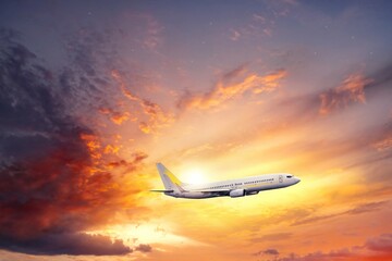 The plane takes off at sunset, air travel to the sky