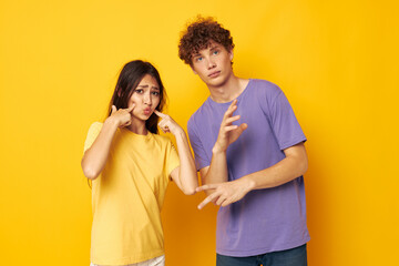 Naklejka premium teenagers in colorful t-shirts posing friendship fun isolated background unaltered