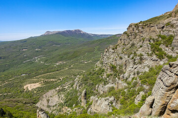 Fototapeta na wymiar View of the Chatyr-Dag plateau from the top of the Demerdzhi mountain range in Crimea. Russia