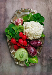 Vintage tray with vegetables: cauliflower, radish, eggplant and kohlrabi