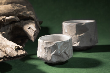 Two ceramic, empty bowls-tyawan, handmade in Japanese style. Wooden, textured snag. Wabi sabi style, handcraft concept, handmade ceramics..