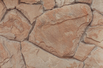 Big stones background with detailed organic texture. Old stone wall close up.
