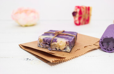 Handmade natural soap with rose and lavender on wooden background