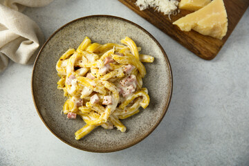 Traditional homemade pasta Carbonara with cheese and ham