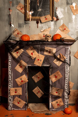 Mysterious house with halloween decorations, selective focus. Halloween holiday concept. Fireplace in the style of Harry Potter